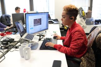 female student gaming at a desk