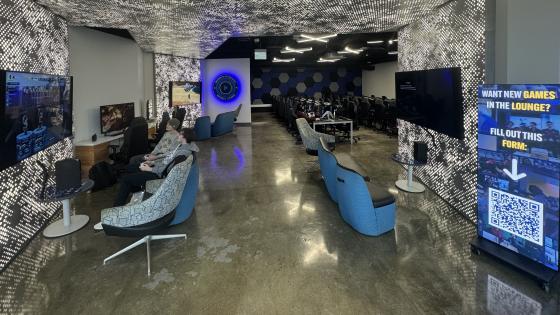 UKY Esports Lounge with consoles, televisions and couches in frame.