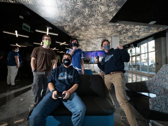 Students play on a console in the UKFCU Gaming lounge.